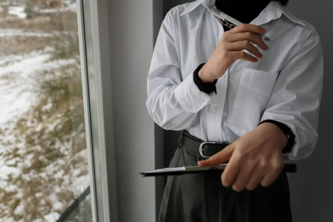 Coordinator with notes at an event venue
