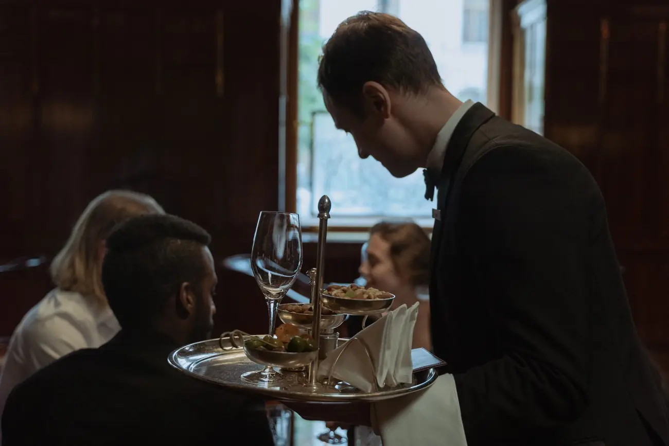 Waiter serving guests at an event